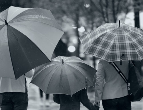 people-standing-with-umbrellas